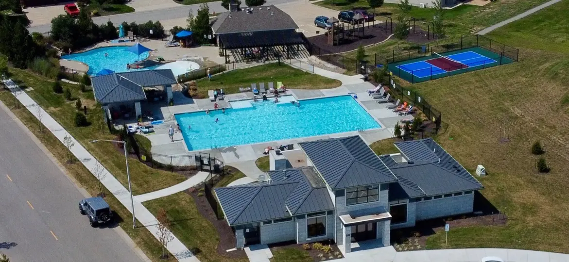 Chapel Hill, Overland Park, Kansas: aerial view of the neighborhood pool, clubhouse, pool house and pickleball courts beside the street