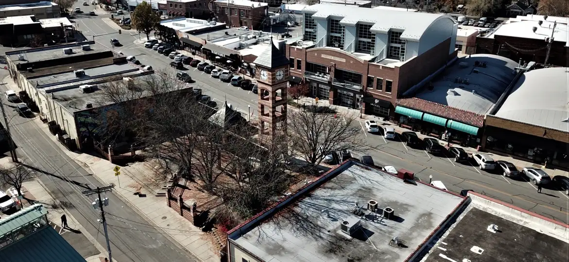 Downtown Overland Park, Overland Park, Kansas: aerial view of storefronts along the street with the brick clock tower